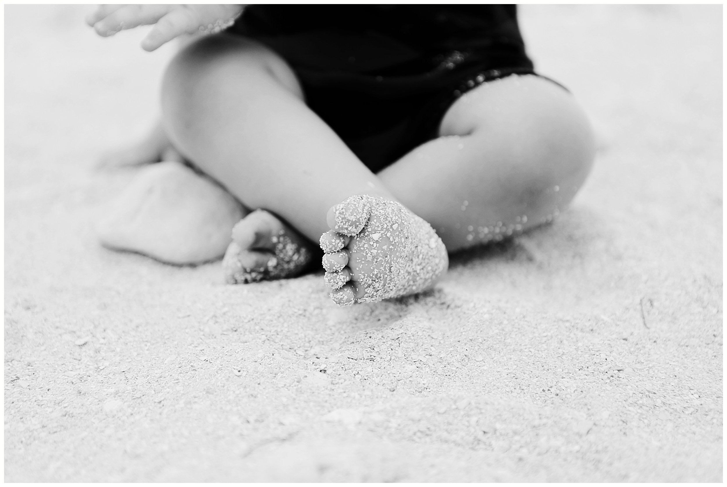 baby feet with sand