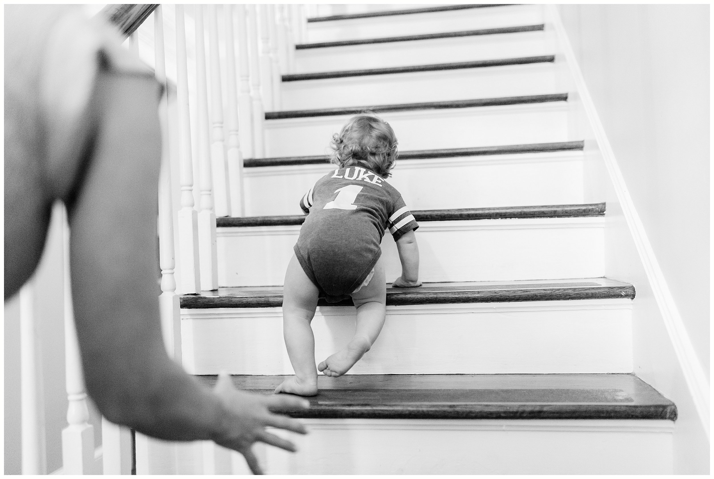  toddler crawling up steps at in-home family photography session Lexington 