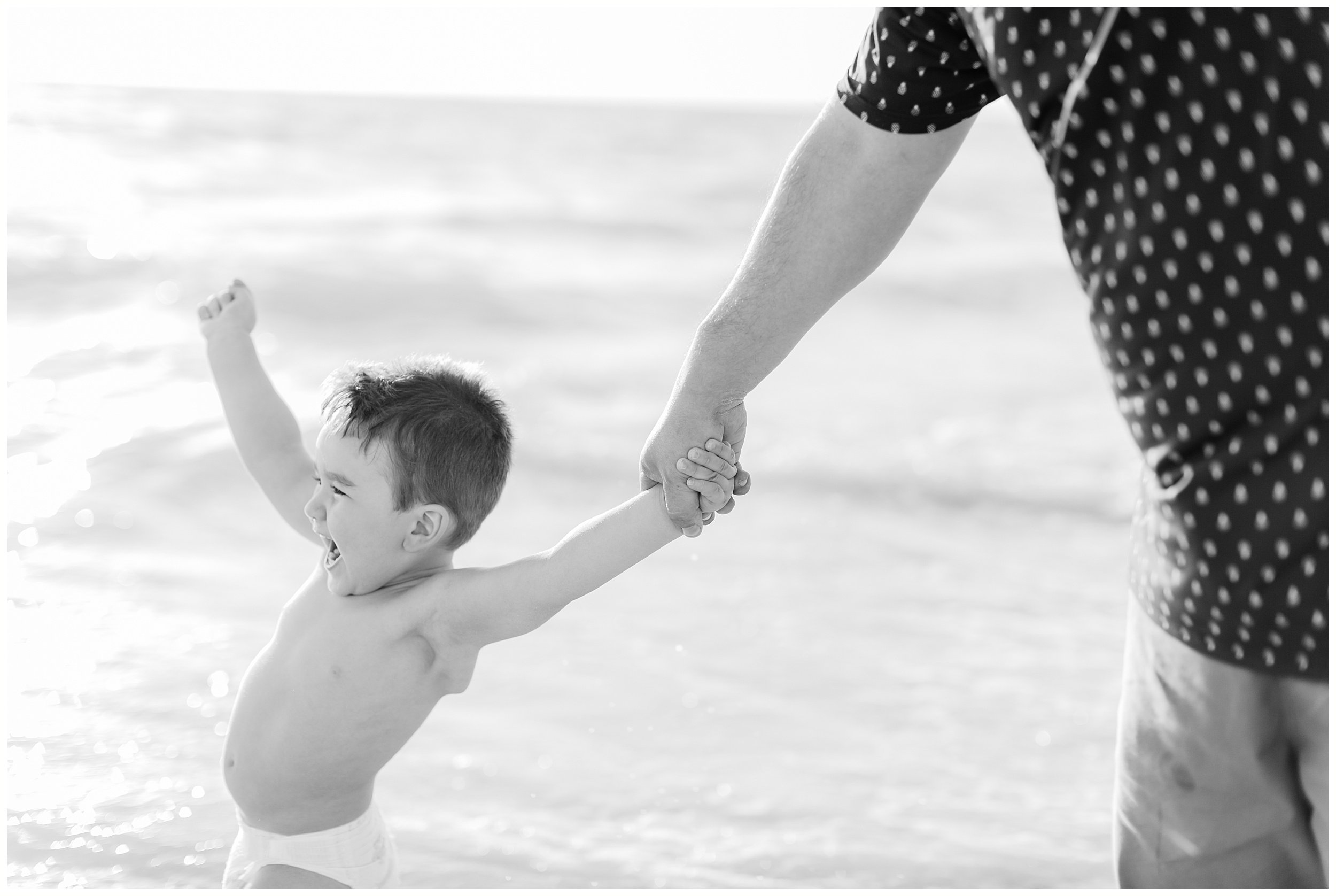  toddler boy excited for beach at family photo session in Dunedin FL 