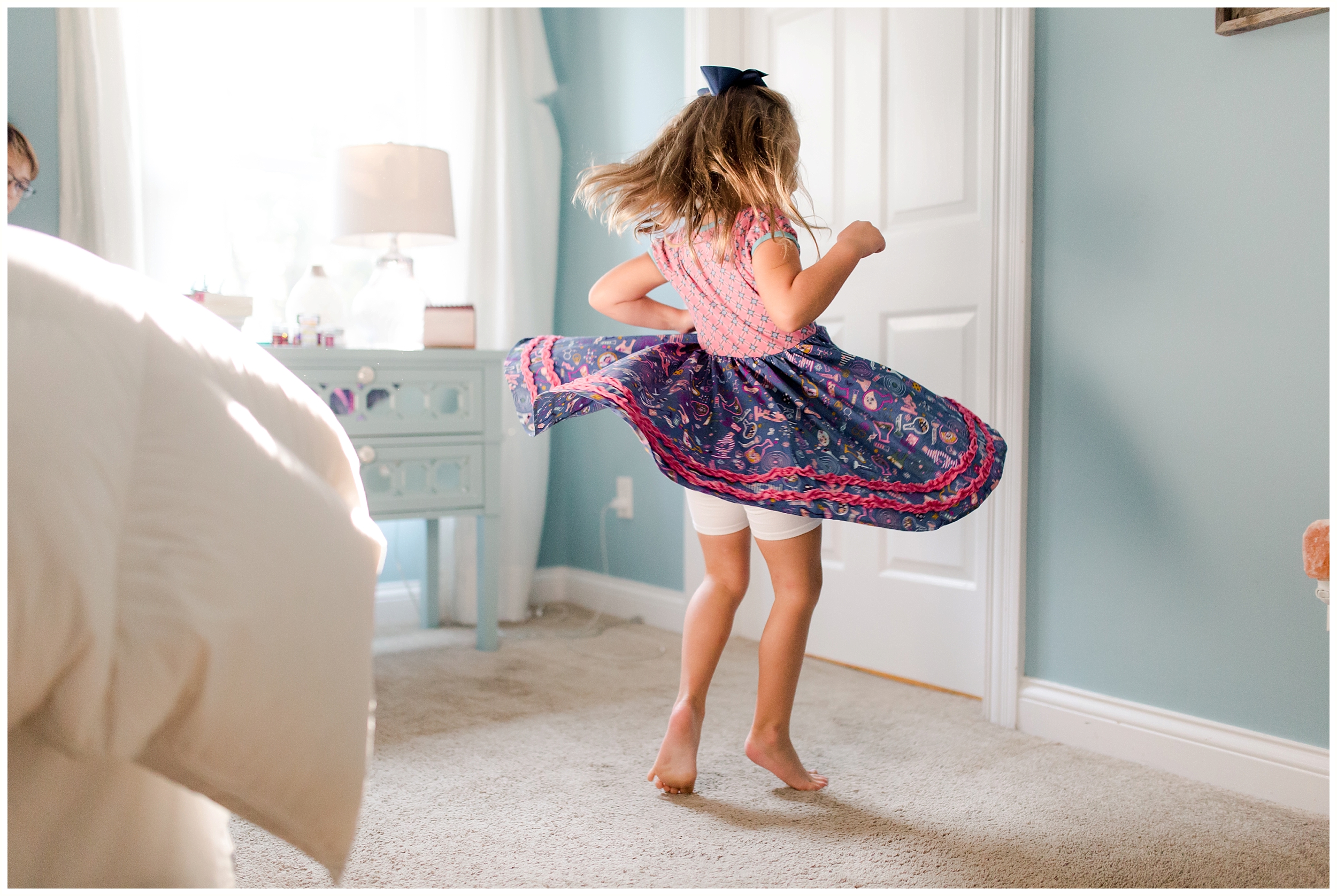  girl pink dress twirling in-home family photography session Lexington KY 
