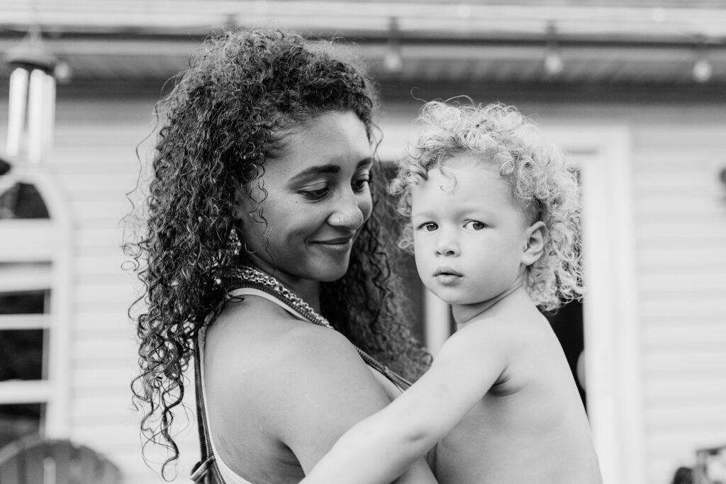 A black and white image of a mom and her daughter.