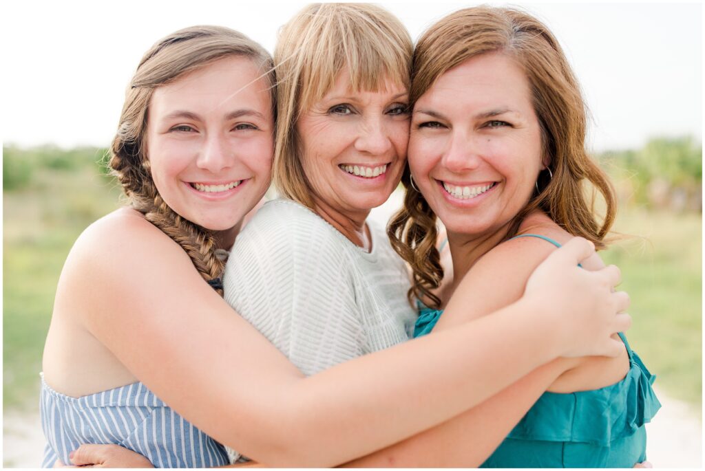Three generations of women from the same family, grandmother, mother and daughter.